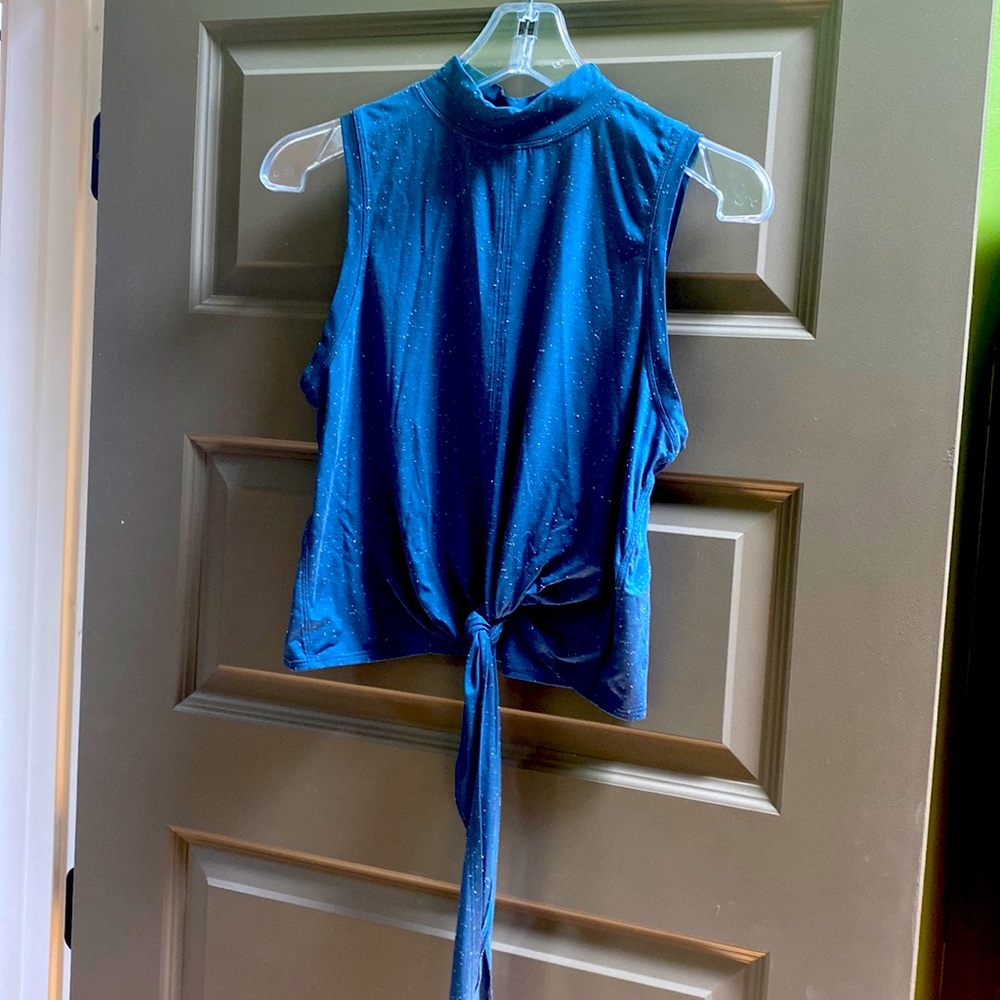 Lululemon yoga top in dusty blue with white specs and bottom tie.